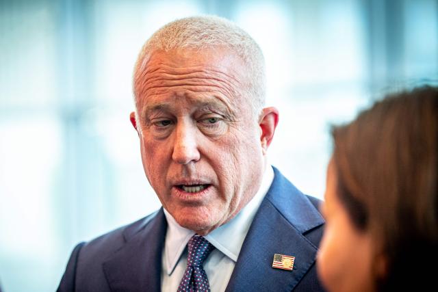 US ambassador to Belgium Bill White looks on during a visit to the Barco technology firm, in Kortrijk on December 3, 2025. (Photo by KURT DESPLENTER / Belga / AFP) / Belgium OUT