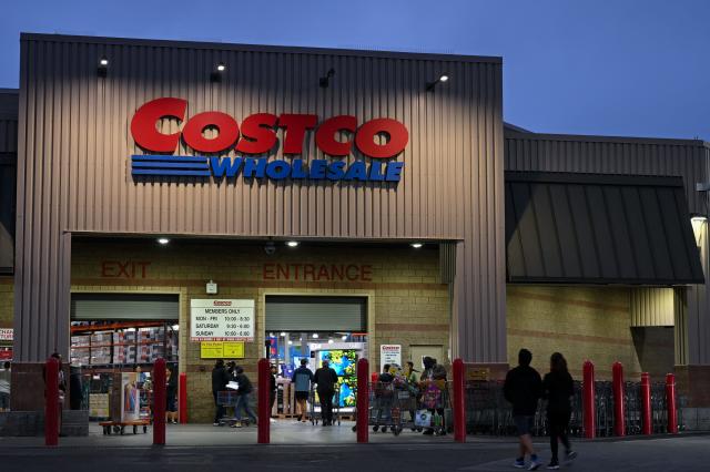 (FILES) Customers enter a Costco Wholesale Corp. warehouse store in Hawthorne, California, on June 12, 2024. The US members-only warehouse retailer Costco has sued President Donald Trump's administration, demanding a refund for tariffs it has paid on imported goods, according to a lawsuit reviewed by AFP. The suit, filed on November 28, 2025, in the US Court of International Trade, says the tariffs are illegal. It does not specify how much reimbursement the multinational company is seeking on tariffs paid since they took effect earlier in Trump's presidency. (Photo by Patrick T. Fallon / AFP)