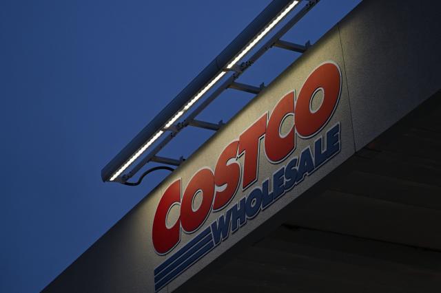 (FILES) The Costco Wholesale Corp. logo is displayed above a gas station in Hawthorne, California, on June 12, 2024. The US members-only warehouse retailer Costco has sued President Donald Trump's administration, demanding a refund for tariffs it has paid on imported goods, according to a lawsuit reviewed by AFP. The suit, filed on November 28, 2025, in the US Court of International Trade, says the tariffs are illegal. It does not specify how much reimbursement the multinational company is seeking on tariffs paid since they took effect earlier in Trump's presidency. (Photo by Patrick T. Fallon / AFP)