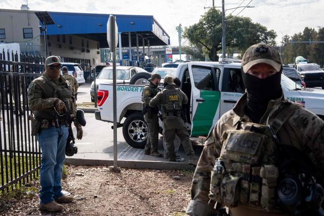 A person is detained by US Customs and Border Patrol (CBP) agents near a Lowe's hardware store in New Orleans, Louisiana, on December 3, 2025. The US Department of Homeland Security announced on Wednesday it has launched a federal immigration enforcement operation, named "Operation Catahoula Crunch," in the New Orleans, Louisiana, area. (Photo by Adam GRAY / AFP)