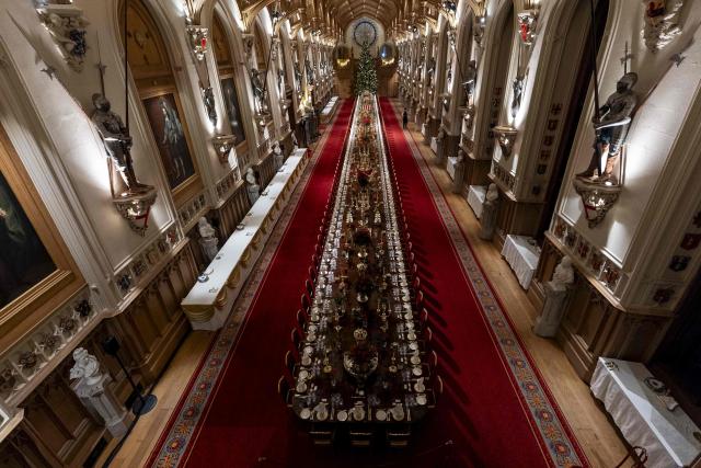 The prepared table is pictured in St George's Chamber ahead of a  State Banquet for the German President and his wife, at Windsor Castle, in Windsor, on December 3, 2025, the first day of a three day state visit by the German President. President Frank-Walter Steinmeier received a ceremonial welcome to Britain Wednesday as his state visit got into full swing -- the first by Germany's official head of state in 27 years. (Photo by Aaron Chown / POOL / AFP)