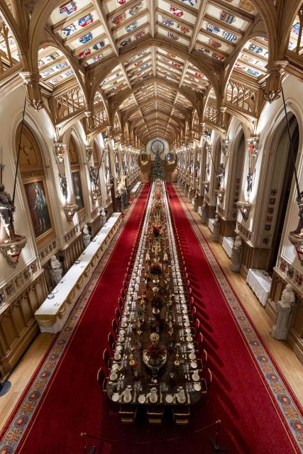 The prepared table is pictured in St George's Chamber ahead of a  State Banquet for the German President and his wife, at Windsor Castle, in Windsor, on December 3, 2025, the first day of a three day state visit by the German President. President Frank-Walter Steinmeier received a ceremonial welcome to Britain Wednesday as his state visit got into full swing -- the first by Germany's official head of state in 27 years. (Photo by Aaron Chown / POOL / AFP)