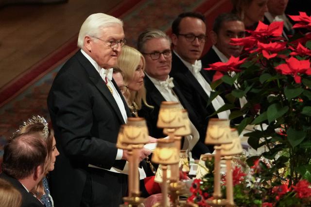Germany's President Frank-Walter Steinmeier delivers a speech during a State Banquet at Windsor Castle in Windsor, on December 3, 2025, the first day of a three day state visit by the German President. President Frank-Walter Steinmeier received a ceremonial welcome to Britain Wednesday as his state visit got into full swing -- the first by Germany's official head of state in 27 years. (Photo by CARLOS JASSO / POOL / AFP)