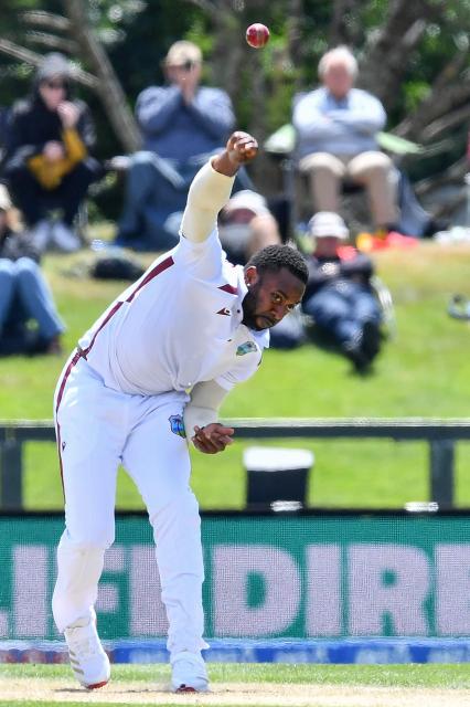 West Indies' Ojay Shields bowls during day three of the first Test cricket match between New Zealand and West Indies at Hagley Oval in Christchurch on December 4, 2025. (Photo by Sanka Vidanagama / AFP)