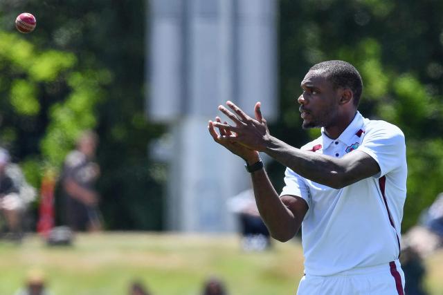 West Indies' Justin Greaves fields the ball during day three of the first Test cricket match between New Zealand and West Indies at Hagley Oval in Christchurch on December 4, 2025. (Photo by Sanka Vidanagama / AFP)