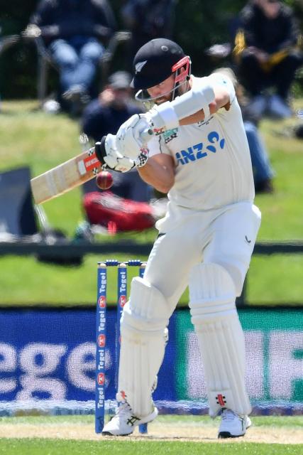 New Zealand's Kane Williamson plays a shot during day three of the first Test cricket match between New Zealand and West Indies at Hagley Oval in Christchurch on December 4, 2025. (Photo by Sanka Vidanagama / AFP)