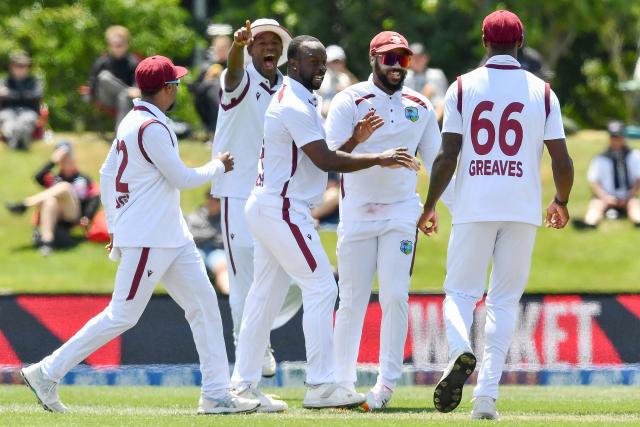 West Indies' Kemar Roach (C) celebrates the dismissal of New Zealand's Kane Williamson with teammates during day three of the first Test cricket match between New Zealand and West Indies at Hagley Oval in Christchurch on December 4, 2025. (Photo by Sanka Vidanagama / AFP)