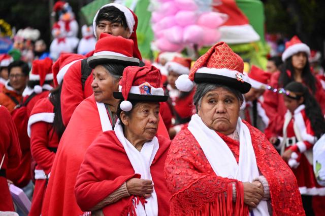 Bolivian Aymara women take part in the annual Christmas parade marking the start of the festive season in La Paz December 3, 2025 (Photo by Aizar RALDES / AFP)