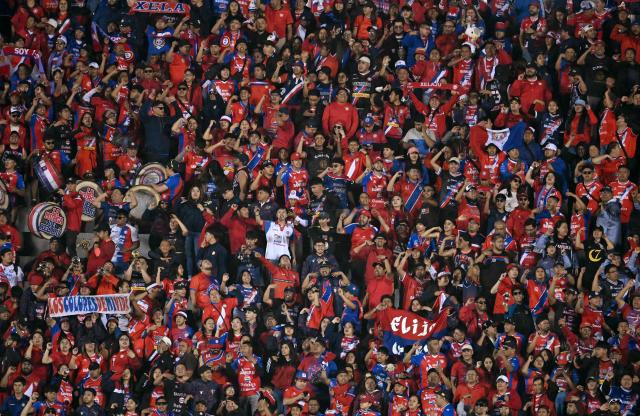 Alajuelense's fans cheer for their team ahead of the second leg of the CONCACAF Central American Cup final football match between Guatemala's Xelaju and Costa Rica's Alajuelense at Mario Camposeco Stadium in Quetzaltenango, Guatemala, on December 3, 2025. (Photo by JOHAN ORDONEZ / AFP)