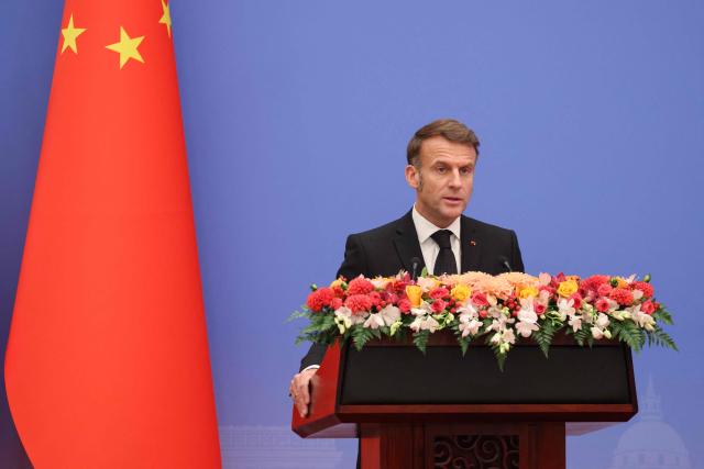 France's President Emmanuel Macron delivers a speech during the 7th formal meeting of the Franco-Chinese Business Council in Beijing on December 4, 2025. (Photo by Ludovic MARIN / POOL / AFP)
