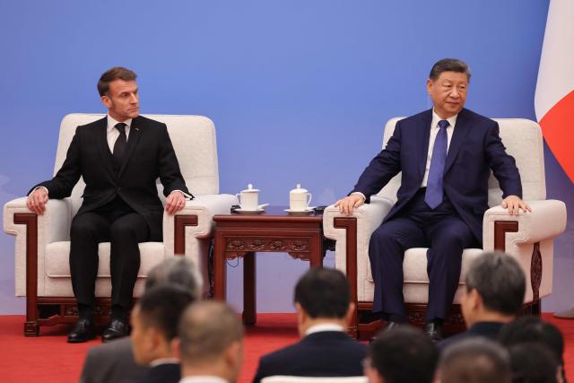 France's President Emmanuel Macron and China's President Xi Jinping attend the 7th formal meeting of the Franco-Chinese Business Council in Beijing on December 4, 2025. (Photo by Ludovic MARIN / POOL / AFP)