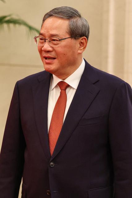 China's Premier Li Qiang arrives for a meeting with France's President Emmanuel Macron in Beijing on December 4, 2025. (Photo by Ludovic MARIN / POOL / AFP)