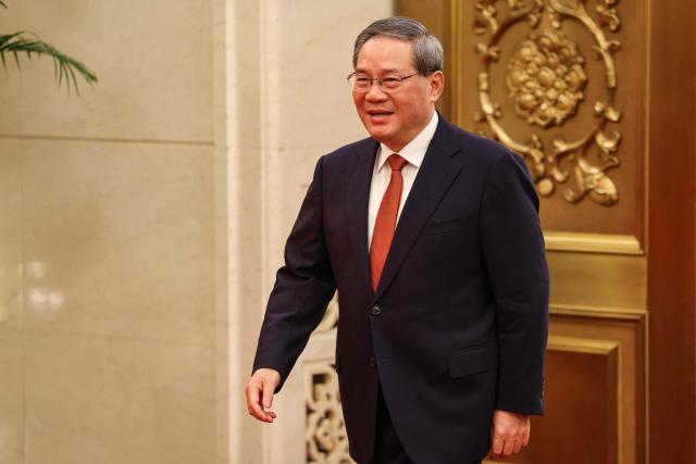 China's Premier Li Qiang arrives for a meeting with France's President Emmanuel Macron in Beijing on December 4, 2025. (Photo by Ludovic MARIN / POOL / AFP)