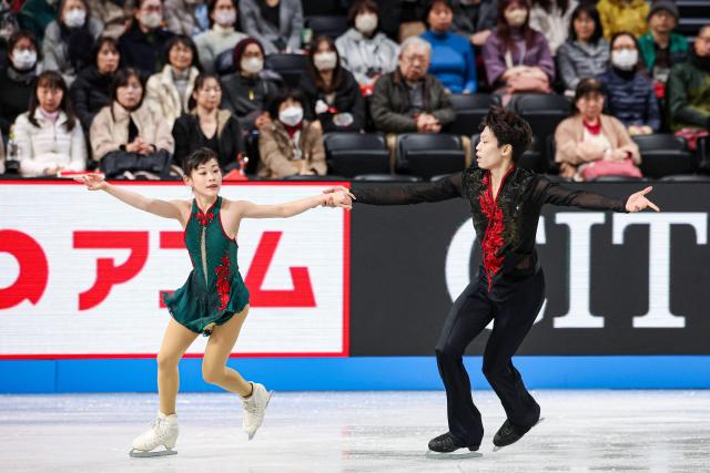 China's Xuanqi Zhang and Wenqiang Feng compete in the Junior Pairs Short Program at the ISU Grand Prix of Figure Skating Final in Nagoya on December 4, 2025. (Photo by PAUL MILLER / AFP)