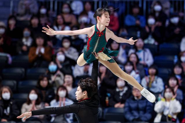 China's Xuanqi Zhang and Wenqiang Feng compete in the Junior Pairs Short Program at the ISU Grand Prix of Figure Skating Final in Nagoya on December 4, 2025. (Photo by PAUL MILLER / AFP)