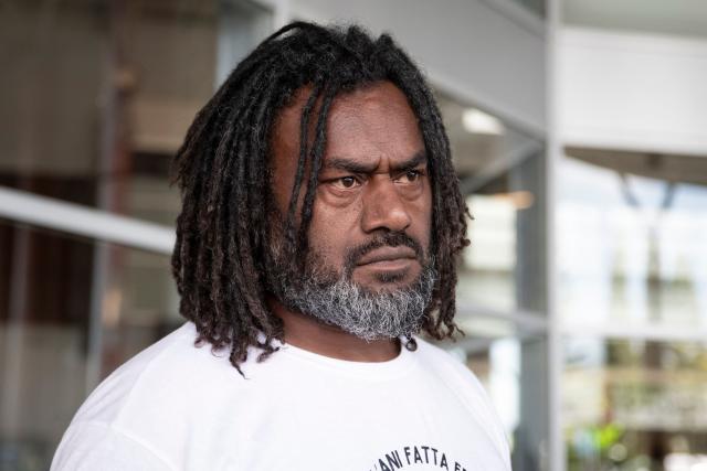 Pro-independence activist Dimitri Quenegei waits for the arrival of Kanak pro-independence leader Christian Tein (L), head of the CCAT (Cellule de Coordination des Actions de Terrain), at the Noumea - La Tontouta international airport in La Tontouta, south of Noumea, in France's Pacific territory of New Caledonia, on December 4, 2025. (Photo by Delphine MAYEUR / AFP)