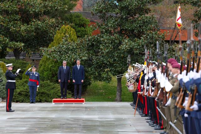 Spain's Prime Minister Pedro Sanchez stands next to Morocco's Prime Minister Aziz Akhannouch during a welcoming ceremony prior to meetings at the Moncloa Palace in Madrid on December 4, 2025. (Photo by Pierre-Philippe MARCOU / AFP)