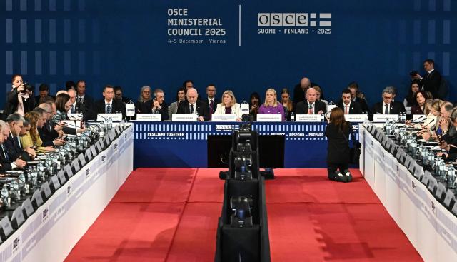 Finland's Foreign Minister Elina Valtonen (C-R), the 2025 Chairperson-in-Office at the OSCE, Austria's Foreign Minister Beate Meinl-Reisinger (C) and OSCE Secretary General Feridun H Sinirlioglu (C-R) open a Ministerial Council meeting of the Oranization for Security and Co-operation in Europe (OSCE) on December 4, 2025 in Vienna, Austria. (Photo by Joe Klamar / AFP)