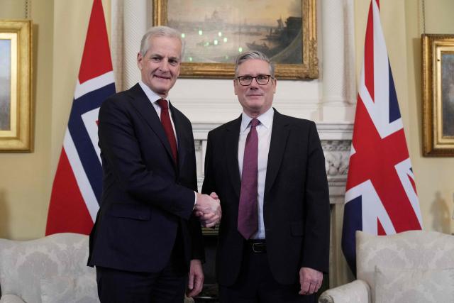 Britain's Prime Minister Keir Starmer (R) shakes hands with Norway's Prime Minister Jonas Gahr Store (L) as he welcomes him to Downing Street in central London on December 4, 2025. (Photo by Alastair Grant / POOL / AFP)