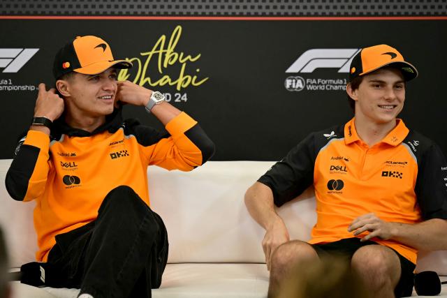 McLaren's British driver Lando Norris (L) and McLaren's Australian driver Oscar Piastri attend a press conference ahead of the Abu Dhabi Formula One Grand Prix at the Yas Marina Circuit in Abu Dhabi on December 4, 2025. (Photo by Giuseppe CACACE / AFP)