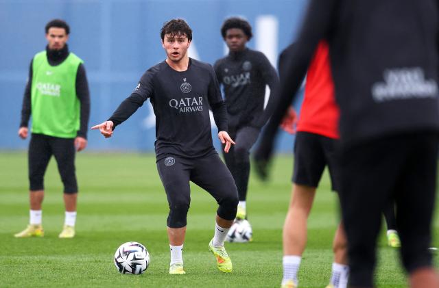 Paris Saint-Germain's Portuguese midfielder #87 Joao Neves plays the ball during a training session in Poissy, west of Paris, on December 4, 2025, two days ahead of the French L1 football match between against Rennes. (Photo by FRANCK FIFE / AFP)