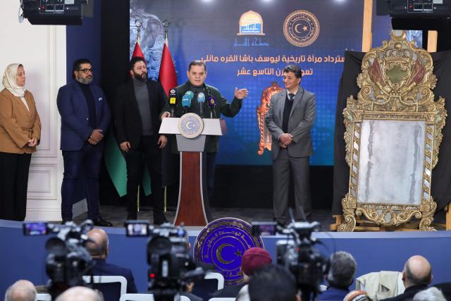 Libya’s Prime Minister Abdelhamid Dbeibah speaks during a press conference in Tripoli on December 4 after the the return of a 19th-century mirror once owned by Yusuf Pasha al-Qaramanli to Libya from the US. (Photo by Mahmud Turkia / AFP)