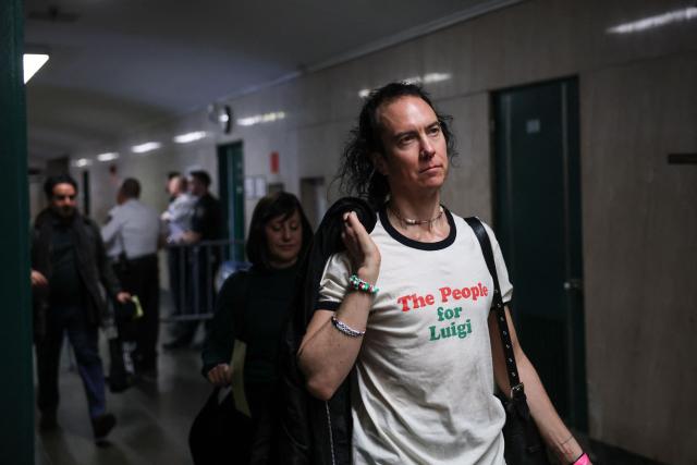 Supporters of Luigi Mangione arrive at Manhattan Supreme Court to attend an evidentiary hearing in the murder case of UnitedHealthcare CEO Brian Thompson, in New York, on December 4, 2025. (Photo by ANGELA WEISS / AFP)