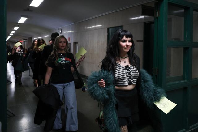 Supporters of Luigi Mangione arrive at Manhattan Supreme Court to attend an evidentiary hearing in the murder case of UnitedHealthcare CEO Brian Thompson, in New York, on December 4, 2025. (Photo by ANGELA WEISS / AFP)