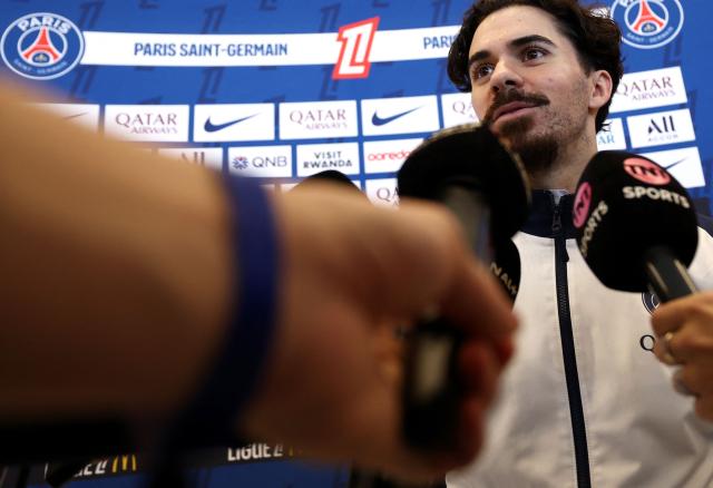 Paris Saint-Germain's Portuguese midfielder #17 Vitinha speaks to press after a training session in Poissy, west of Paris, on December 4, 2025, two days ahead of the French L1 football match between against Rennes. (Photo by FRANCK FIFE / AFP)