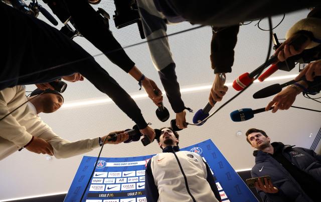 Paris Saint-Germain's Portuguese midfielder #17 Vitinha speaks to press after a training session in Poissy, west of Paris, on December 4, 2025, two days ahead of the French L1 football match between against Rennes. (Photo by FRANCK FIFE / AFP)