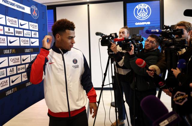 Paris Saint-Germain's French midfielder #14 Desire Doue speaks to press after a training session in Poissy, west of Paris, on December 4, 2025, two days ahead of the French L1 football match between against Rennes. (Photo by FRANCK FIFE / AFP)