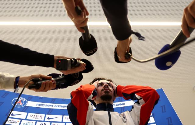 Paris Saint-Germain's Portuguese midfielder #17 Vitinha speaks to press after a training session in Poissy, west of Paris, on December 4, 2025, two days ahead of the French L1 football match between against Rennes. (Photo by FRANCK FIFE / AFP)