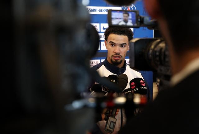 Paris Saint-Germain's French midfielder #33 Warren Zaire-Emery speaks to press after a training session in Poissy, west of Paris, on December 4, 2025, two days ahead of the French L1 football match between against Rennes. (Photo by FRANCK FIFE / AFP)