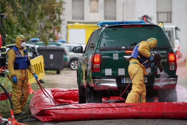 Members of Spain's Emergency Military Unit (UME) carry out protective disinfection of a vehicle at a wildlife recovery center in the area of an outrbeak of African swine fever as authorities work to contain it in Santa Perpetua de Mogoda, outside Barcelona, on December 4, 2025. Earlier this week Spain deployed more than 100 army troops to help some 300 Catalan regional officials to contain an outbreak of African swine fever that has sparked fears for the country's powerful pork export industry. 
Swine fever does not affect humans but is highly contagious and lethal for pigs. Any spread of the disease to farms could seriously harm the world's third-largest producer of pork and pork derivatives. The virus, however, has not been detected on any of the farms located within a 20-kilometer radius of the infected area. (Photo by Manaure Quintero / AFP)