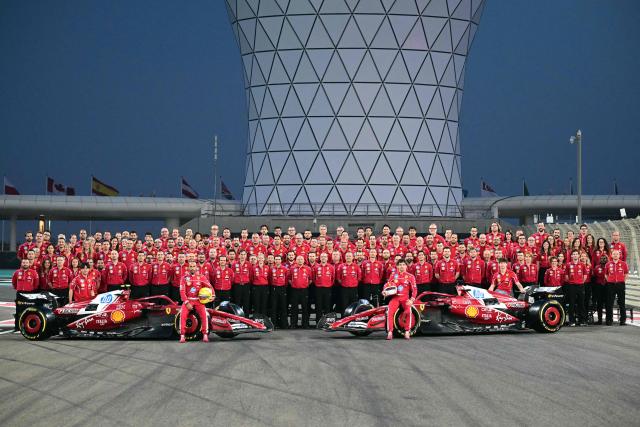 Ferrari team poses for group photo ahead of the Abu Dhabi Formula One Grand Prix at the Yas Marina Circuit in Abu Dhabi on December 4, 2025. (Photo by Giuseppe CACACE / AFP)