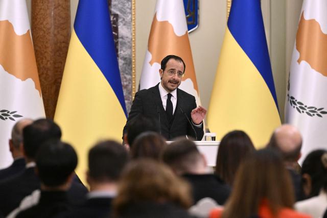 President of Cyprus Nikos Christodoulides addresses the audience during a joint media briefing with Ukraine's President following their meeting in Kyiv on December 4, 2025, amid the Russian invasion of Ukraine. (Photo by Genya SAVILOV / AFP)