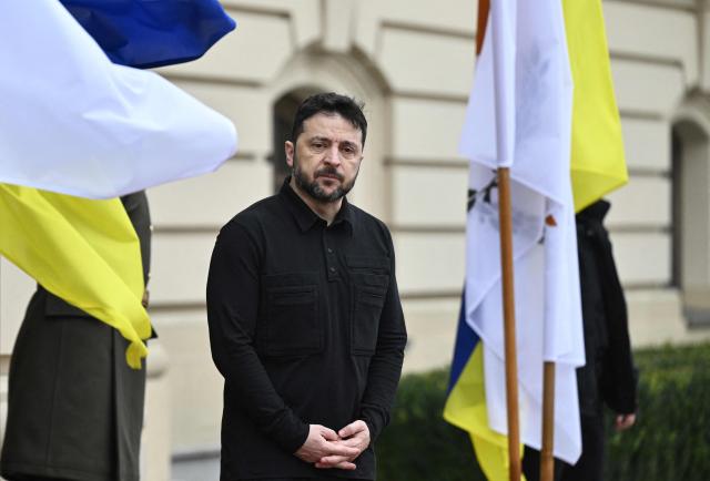 President of Ukraine Volodymyr Zelensky looks on before his meeting with President of Cyprus in Kyiv on December 4, 2025, amid the Russian invasion of Ukraine. (Photo by Genya SAVILOV / AFP)