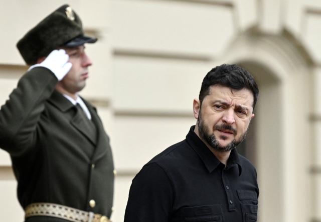 President of Ukraine Volodymyr Zelensky looks on before his meeting with President of Cyprus in Kyiv on December 4, 2025, amid the Russian invasion of Ukraine. (Photo by Genya SAVILOV / AFP)