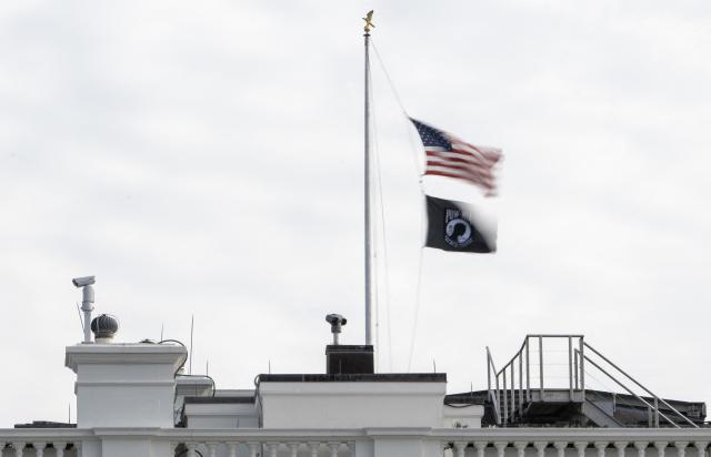 The US National flag is lowered to half mast at the White House in Washington, DC on December 4, 2025,  in honor of Sarah Beckstrom, the National Guard member who was fatally shot the week before. An Afghan man accused of shooting two members of the National Guard near the White House, killing one, pleaded not guilty on December 2, 2025 to murder charges. Lakanwal is charged with first-degree murder for the death of Sarah Beckstrom, 20, a National Guard member from West Virginia, as well as assault with intent to kill and firearms offenses. (Photo by ANDREW CABALLERO-REYNOLDS / AFP)