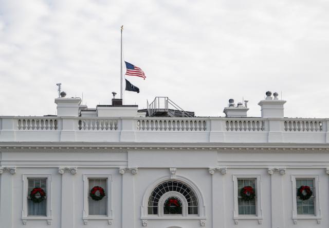 The US National flag is lowered to half mast at the White House in Washington, DC on December 4, 2025,  in honor of Sarah Beckstrom, the National Guard member who was fatally shot the week before. An Afghan man accused of shooting two members of the National Guard near the White House, killing one, pleaded not guilty on December 2, 2025 to murder charges. Lakanwal is charged with first-degree murder for the death of Sarah Beckstrom, 20, a National Guard member from West Virginia, as well as assault with intent to kill and firearms offenses. (Photo by ANDREW CABALLERO-REYNOLDS / AFP)