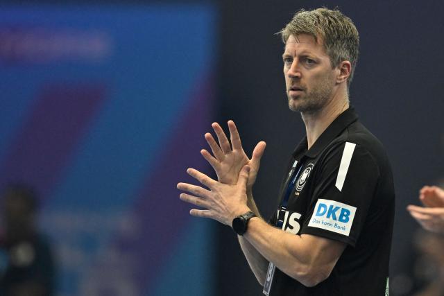 Germany's coach Markus Gaugisch reacts during the main round - Day 5 Group II handball match Montenegro v Germany of the IHF Women's Handball World Championship in Dortmund, western Germany on December 4, 2025. (Photo by INA FASSBENDER / AFP)