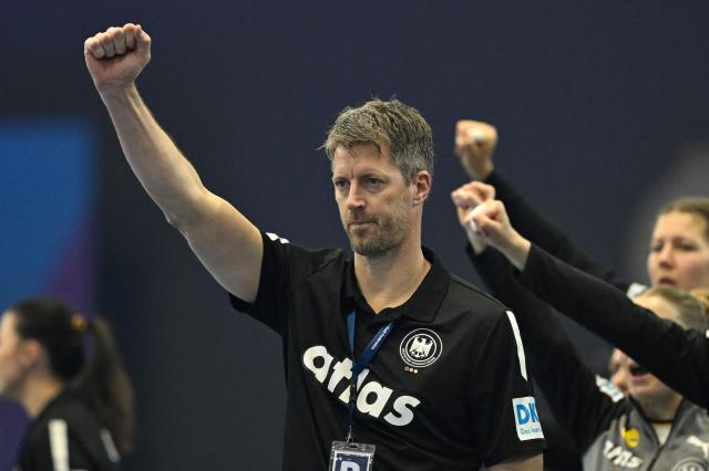 Germany's coach Markus Gaugisch reacts during the main round - Day 5 Group II handball match Montenegro v Germany of the IHF Women's Handball World Championship in Dortmund, western Germany on December 4, 2025. (Photo by INA FASSBENDER / AFP)