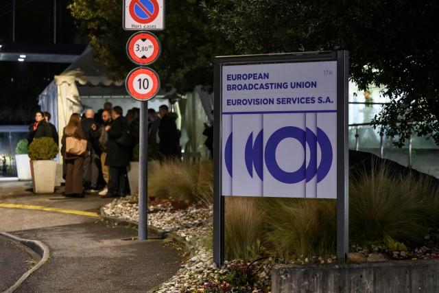 Delegates leave the headquarters of the European Broadcasting Union (EBU) after the first day of a two-day general assembly of the EBU, which organises the Eurovision Song Contest, in Geneva, on December 4, 2025. Israel will be allowed to take part in the 2026 Eurovision Song Contest, organisers decided, announcing a series of measures meant to address criticism over the country's participation. (Photo by Fabrice COFFRINI / AFP)