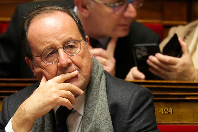 Socialistes et Apparentes' MP Francois Hollande reacts during a session devoted to the second reading of the 2026 social security budget bill (PLFSS) at the National Assembly, the French Parliament lower house, in Paris on December 4, 2025. (Photo by Thomas SAMSON / AFP)