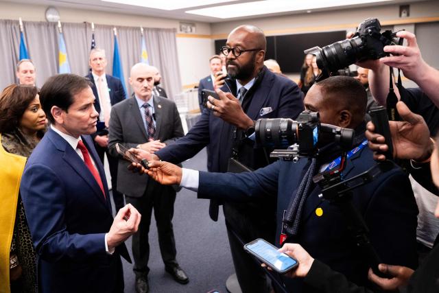 US Secretary of State Marco Rubio (L) speaks with reporters after signing agreements with the Foreign Minister of the Democratic Republic of the Congo Therese Kayikwamba Wagner and her Rwandan counterpart Olivier Nduhungirehe during a ceremony at the US Institute of Peace in Washington, DC on December 4, 2025. US President Donald Trump on Thursday brings the leaders of Rwanda and the Democratic Republic of Congo together to endorse a deal that Trump has hailed as his latest peace triumph despite ongoing violence on the ground. Trump hopes the agreement will pave the way for the United States to gain access to critical minerals in the eastern DRC, a violence-torn region home to many of the key ingredients in modern technologies such as electric cars. (Photo by Allison ROBBERT / AFP)