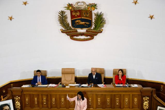 Venezuela's Vice President Delcy Rodriguez (C) speaks during the presentation of the 2026 fiscal year budget at the National Legislative Congress in Caracas on December 4, 2025. (Photo by Pedro MATTEY / AFP)