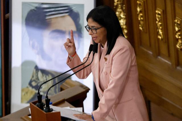 Venezuela's Vice President Delcy Rodriguez speaks past a portrait of the liberator Simon Bolivar during the presentation of the 2026 fiscal year budget at the National Congress in Caracas on December 4, 2025. (Photo by Pedro MATTEY / AFP)