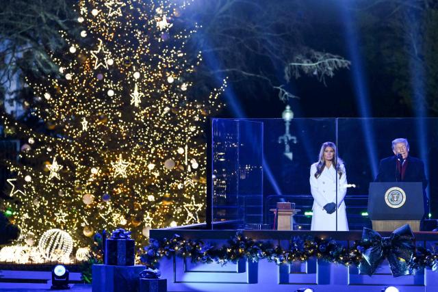 US President Donald Trump and First Lady Melania Trump attend the National Christmas Tree Lighting at the Ellipse in Washington, DC, on December 4, 2025. (Photo by ANDREW CABALLERO-REYNOLDS / AFP)
