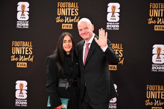 FIFA President Gianni Infantino and his wife Leena Al Ashqar arrive for the pre-draw reception for the 2026 FIFA Football World Cup taking place in the US, Canada and Mexico, at the Kennedy Center, in Washington, DC, on December 4, 2025. (Photo by Roberto SCHMIDT / AFP)