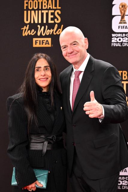 FIFA President Gianni Infantino and his wife Leena Al Ashqar arrive for the pre-draw reception for the 2026 FIFA Football World Cup taking place in the US, Canada and Mexico, at the Kennedy Center, in Washington, DC, on December 4, 2025. (Photo by Roberto SCHMIDT / AFP)